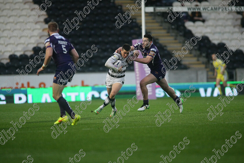 DLPL0077 
 Jake Connor tackels Jamie Shaul 
 Keywords: Hull FC, Huddersfield Giants