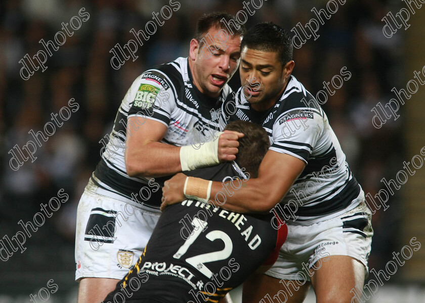 fc-bulls0712A 
 bradford's elliott whitehead gets no quarter from hull fc's experienced duo andy lynch and willie manu