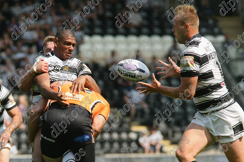 fc-castleford0169 
 Leon Pryce offloads to Joe Westerman but its called forward 
 Keywords: Hull FC, Castleford Tigers